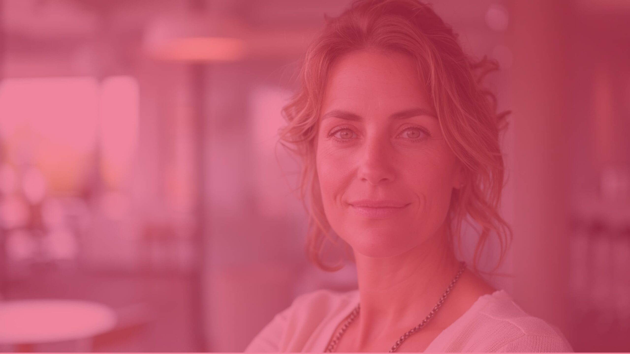 Portrait of a woman founder in a modern office, looking at the camera