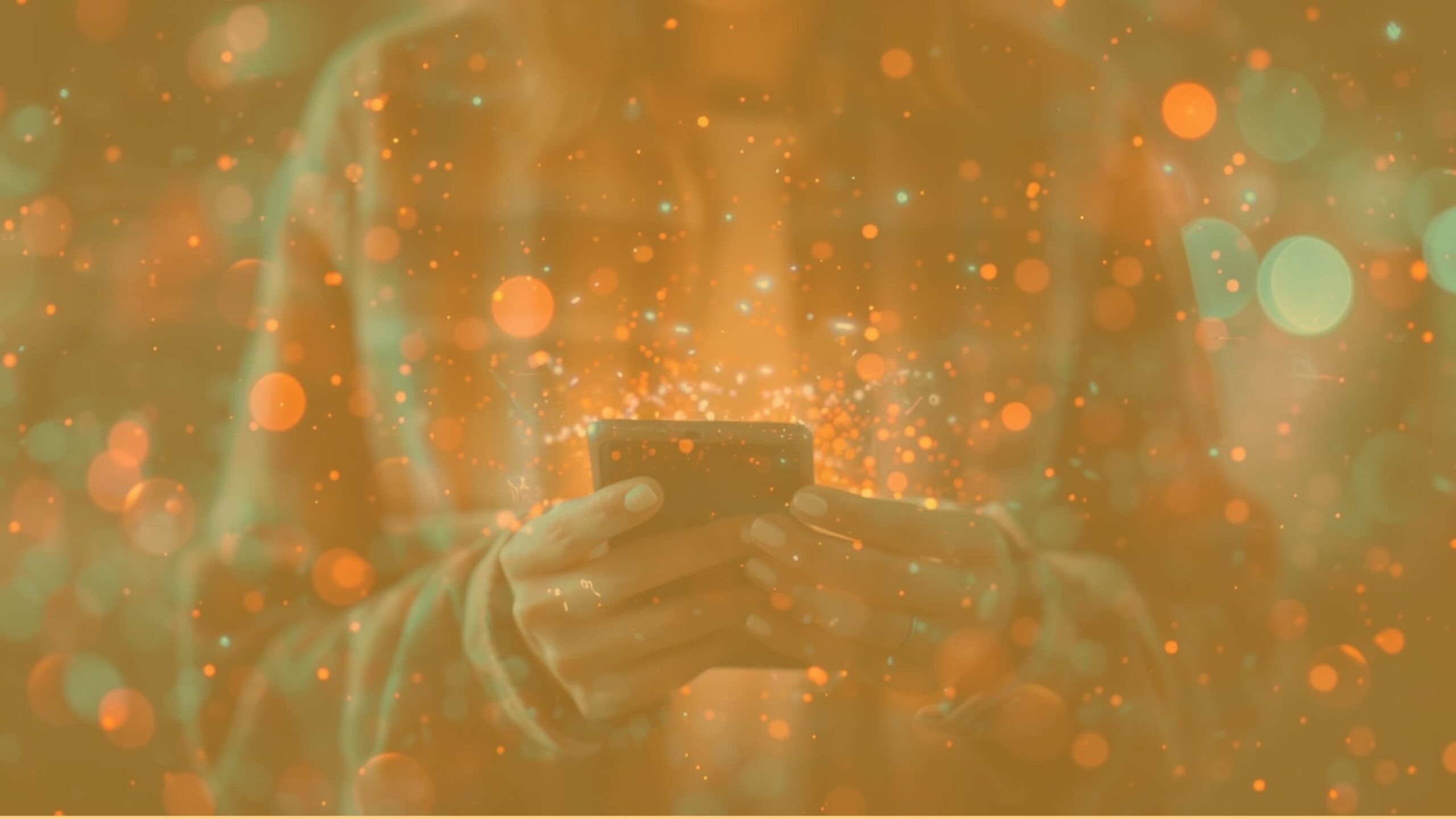 Person holding a smartphone with glowing light trails and bokeh, symbolizing invisible engagement and dark social activity.